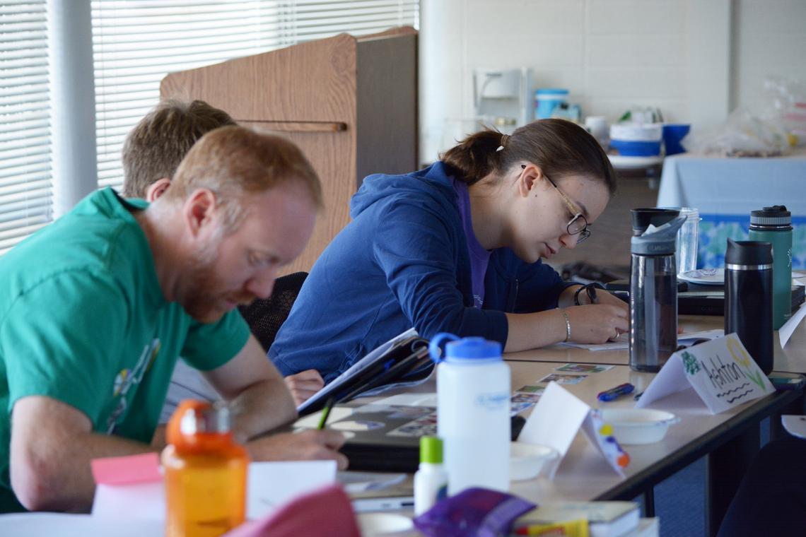 Middle school teacher Ryan Robinson and high school teacher Valerie Thaler deep in writing mode Middle school teacher Ryan Robinson and high school teacher Valerie Thaler deep in writing mode
